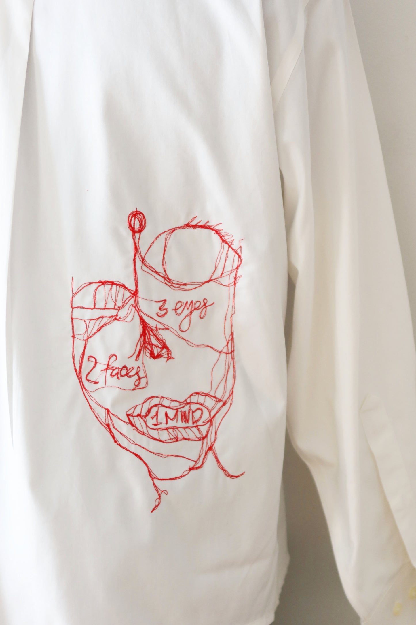 Three Eyes, Two Faces, One Mind - Embroidered Art Shirt